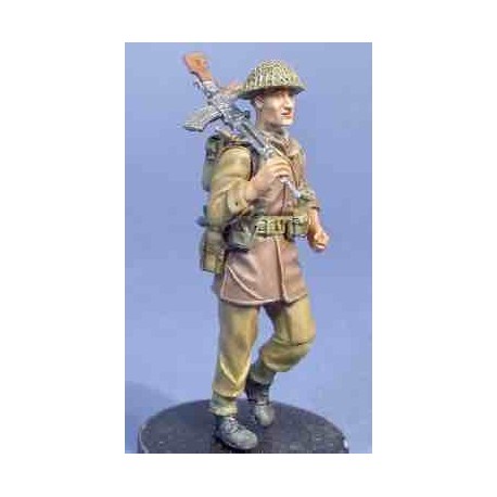 UK soldier walking with Bren gun