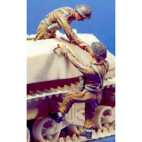 UK soldiers climbing onto vehicle